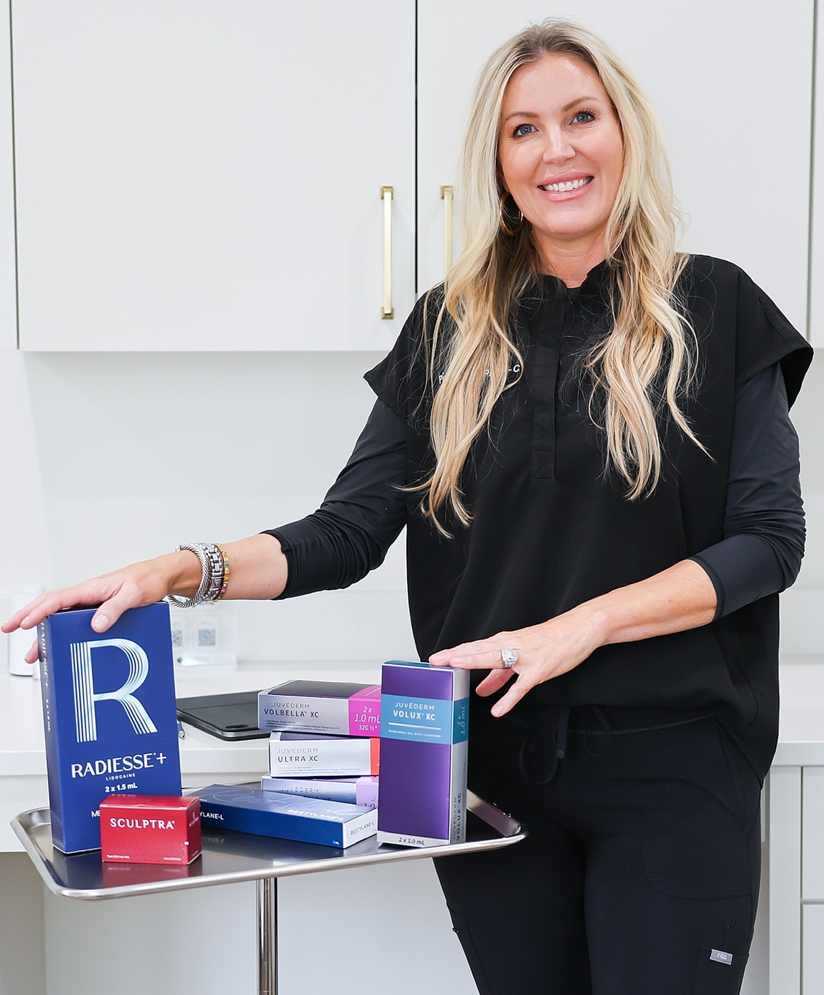 Professional with skincare products in clinic setting
