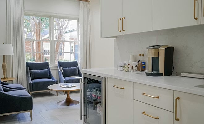 Modern kitchen and seating area with natural light.