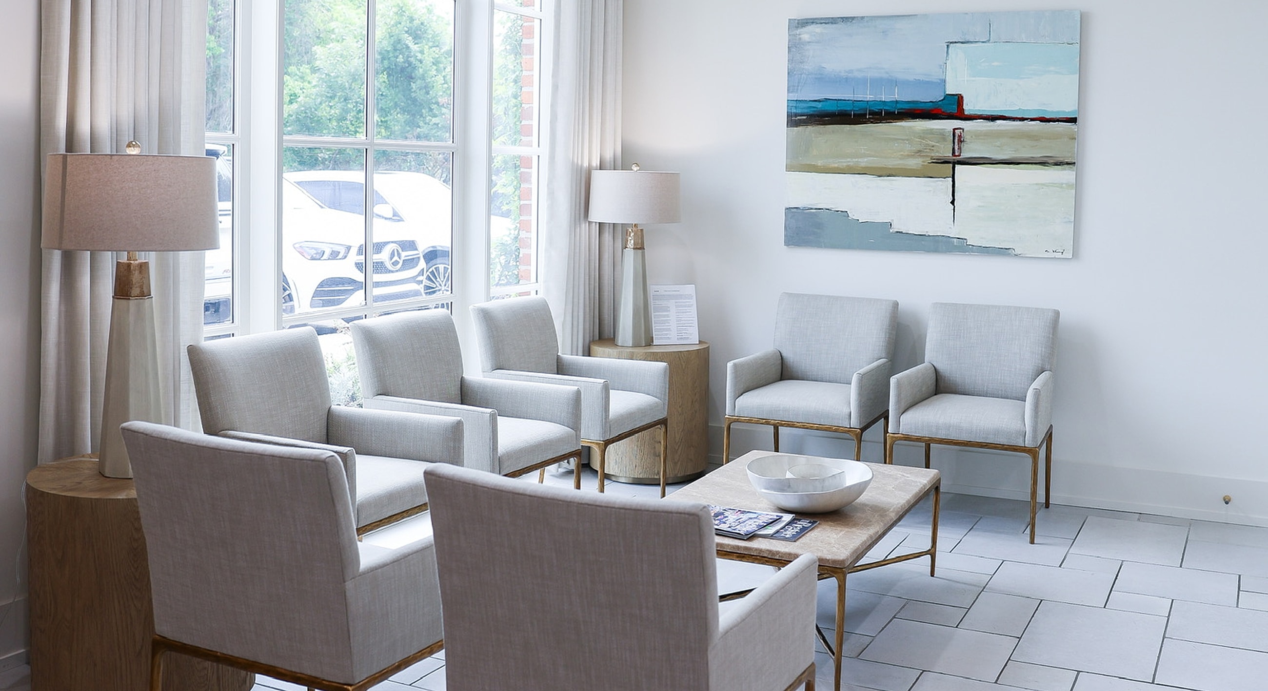 Modern waiting area with light gray chairs.