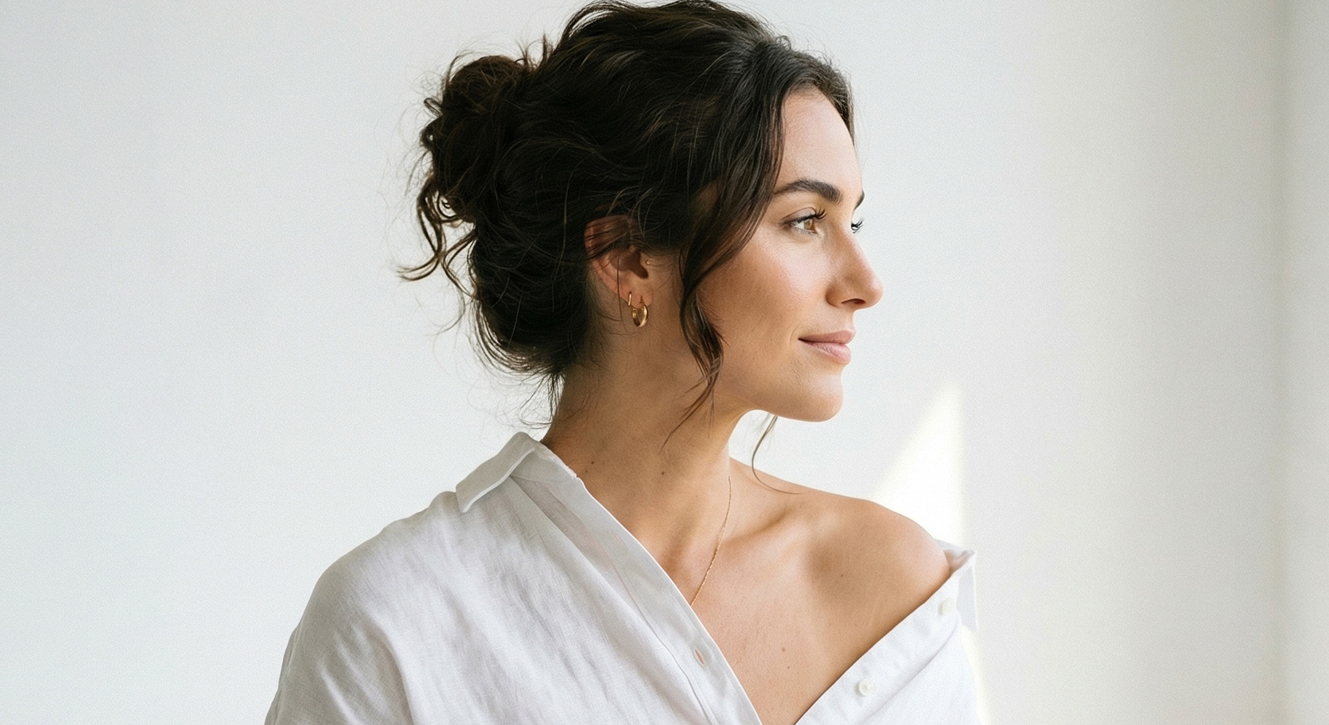 Profile portrait of a woman in natural light.